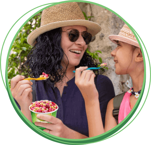 Woman and daughter enjoying Fruit Pearls on a hot day