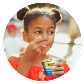 Young girl enjoying Dessert Pearls